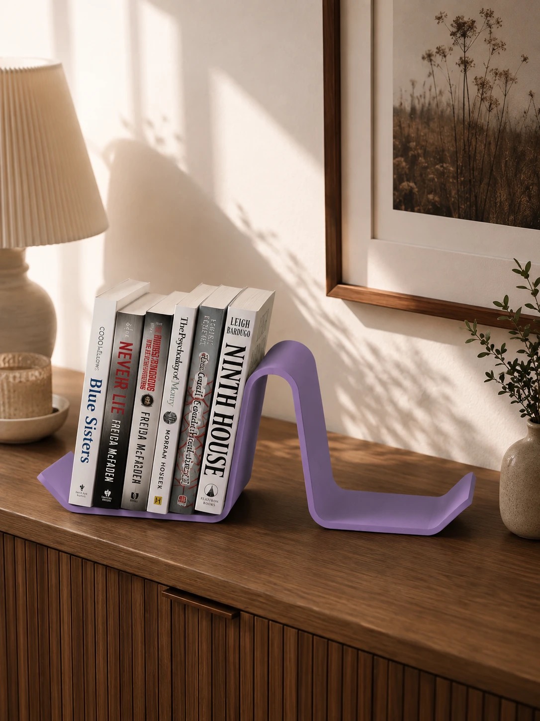 Lilac Purple Main Street Bookend holding a row of books